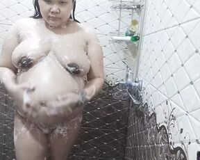 Pregnant wife showering