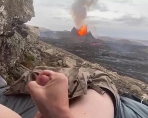 The guy masturbates to the eruption of the volcano, and then his cock spews sperm