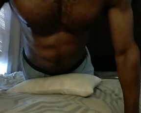 Fit guy dry humping his cock against the bed